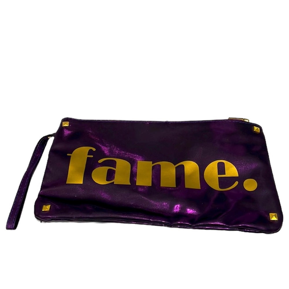 Iridescent purple zippered wristlet/pouch. Front says Fame in gold. NWOT